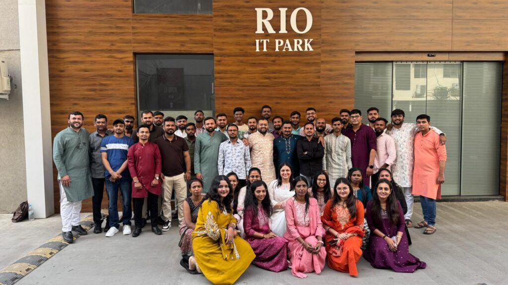 team photo — full FSPL crew at Surat HQ, wide